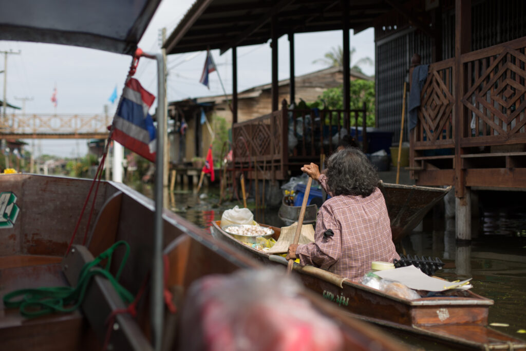 Local woman on her shopping boat